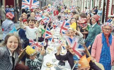 Vintage picture of Brits celebrating the Coronation at a street party