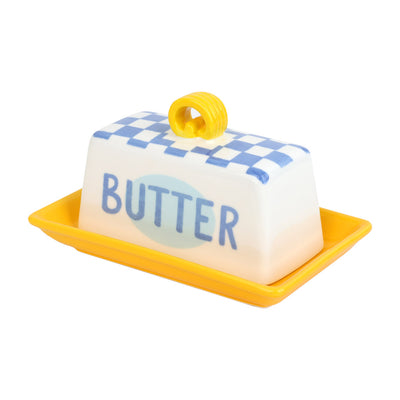Butter dish with blue checkered lid and yellow handle on a white background